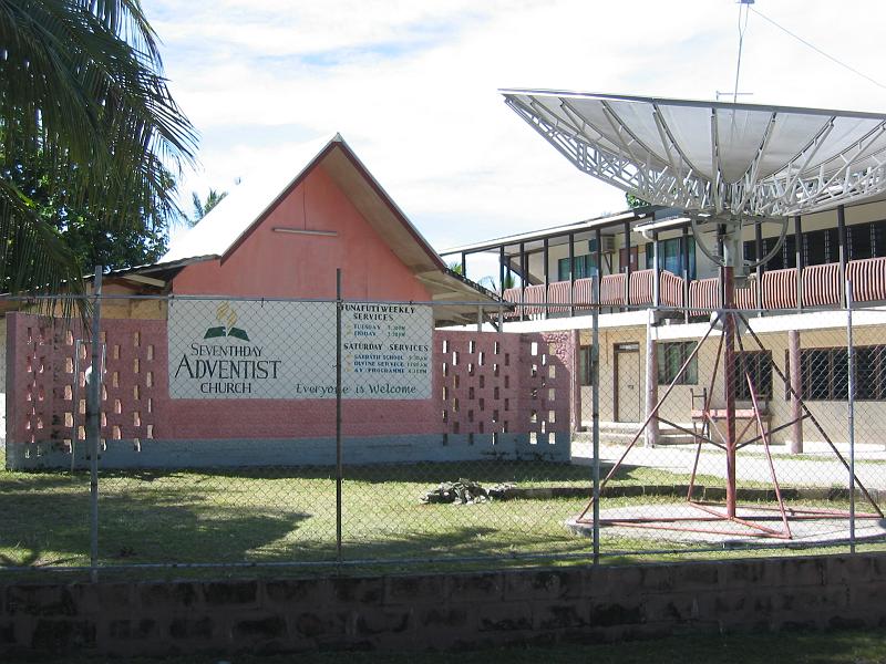 tuv15 Like in most of the South Pacific, religion plays a big role in Tuvalu. Protestants are the majority, but a surprising number of other confessions can also be found. Here is one, complete with telecommunications antenna.